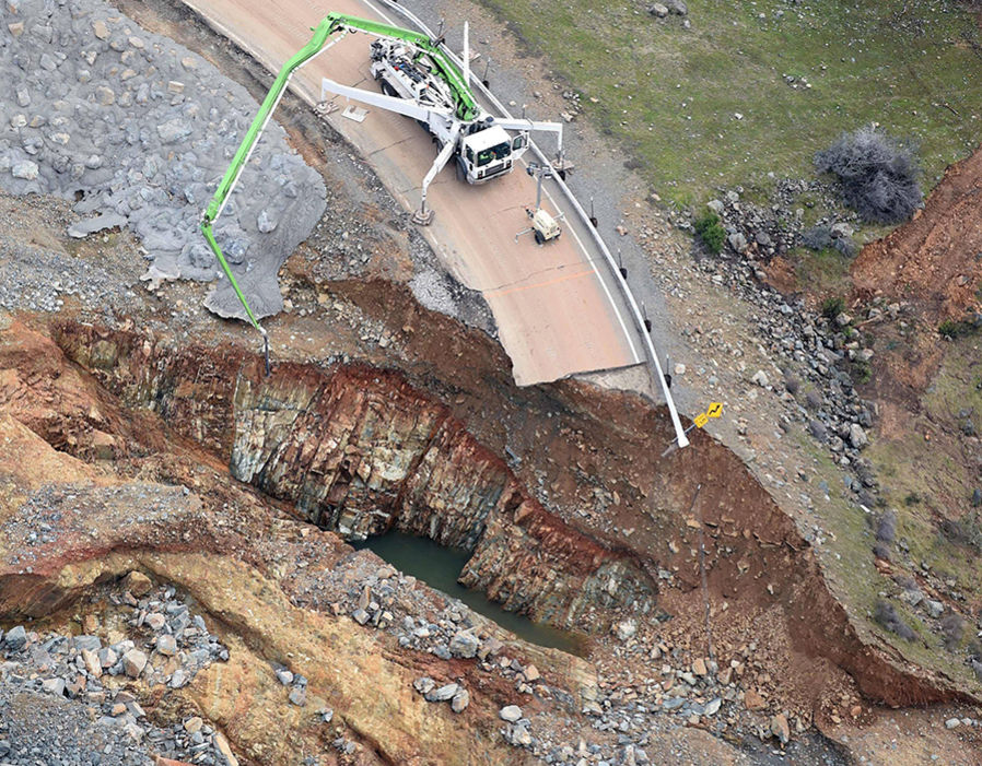 Crews work on a damaged section of the Oroville Dam in Oroville California