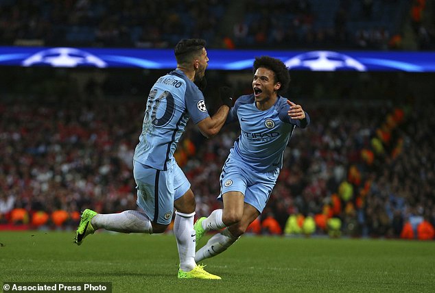 Manchester City's Sergio Aguero left celebrates with Leroy Sane after scoring his side's third goal during the Champions League round of 16 first leg soccer match between Manchester City and Monaco at the Etihad Stadium in Manchester England Tuesday F