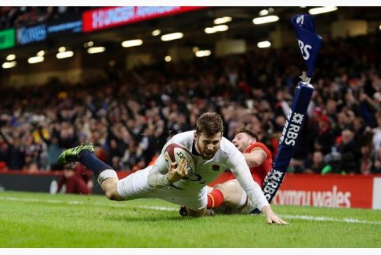 England's Elliot Daly scores their second try during the Six Nations rugby match Wales against England at the Principality Stadium Cardiff Wales Saturday Feb. 11 2017