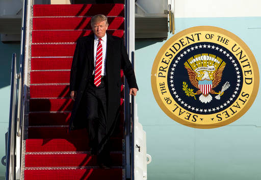 President Donald Trump walks down the steps of Air Force One upon his arrival at Andrews Air Force Base Md. Monday Feb. 6 2017 returning from a weekend trip to Florida