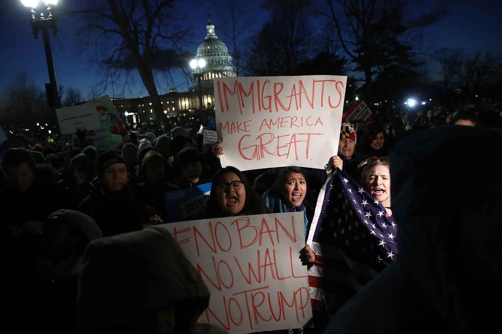 Protesters demonstrate as Senate Minority Leader Chuck Schumer and House Minority Leader Nancy Pelosi lead members of Congress during a protest on the steps of the U.S. Supreme Court