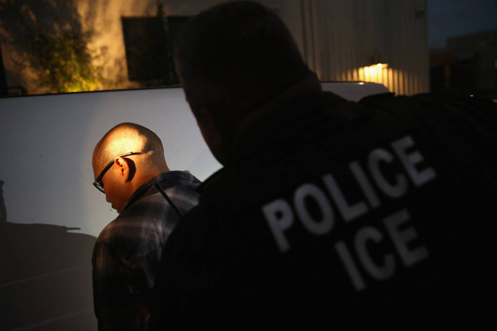 Immigration and Customs Enforcement agents detain a man in Los Angeles in 2015