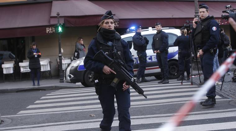 Police officers take position outside the Louvre museum in Paris,Friday Feb. 3 2017. Paris police say a soldier has opened fire outside the Louvre Museum after he was attacked by someone and the area is being evacuated