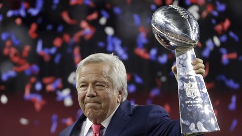 New England Patriots owner Robert Kraft raises the the Vince Lombardi Trophy after his team defeated the Atlanta Falcons in overtime at the NFL Super Bowl 51 football game Sunday Feb. 5 2017 in Houston. The Patriots defeated the Falcons 34-28. (AP Phot