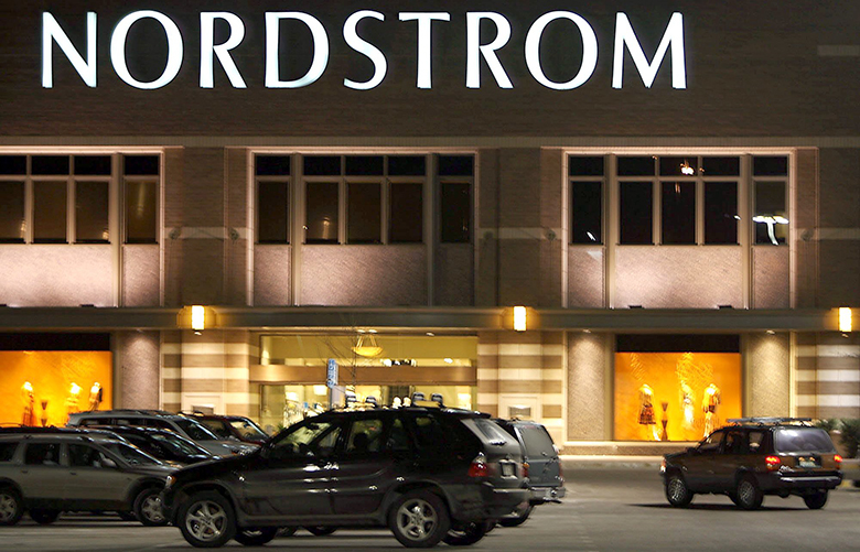 A vehicle pulls in to a parking spot outside the Nordstrom’s department store in Park Meadows Mall in the southeast Denver suburb of Lone Tree Colo