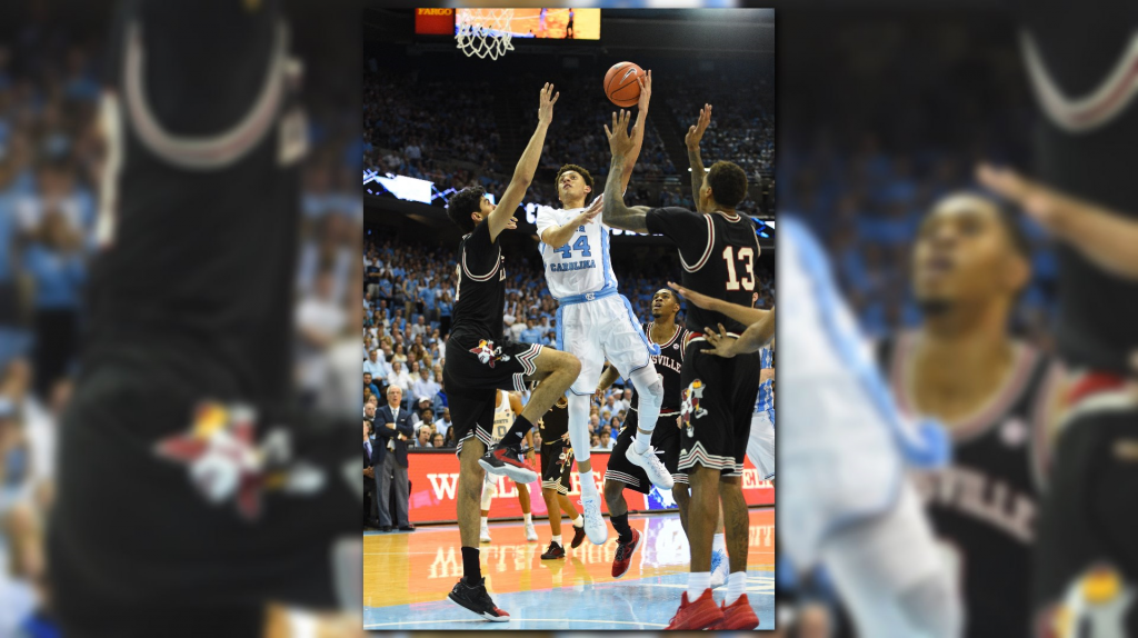 Rick Pitino had to be held back from furiously confronting a UNC fan