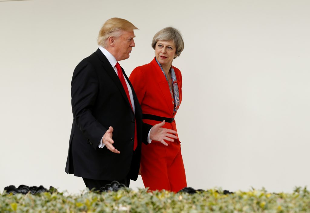 U.S. President Donald Trump escorts British Prime Minister Theresa May down the White House colonnade Jan. 27 after their meeting at the White House in Washington D.C