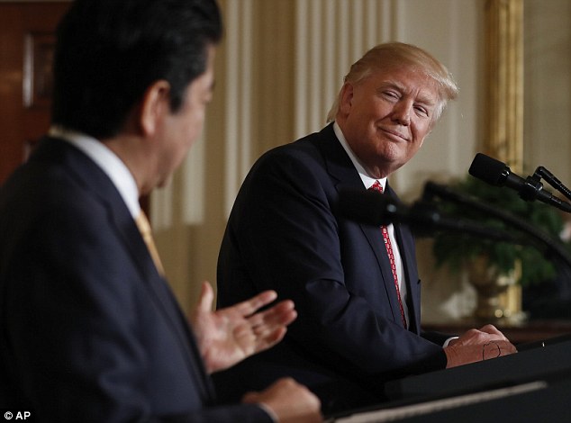 President Donald Trump may not have been wearing an earpiece during the first part of a news conference today with Japan's PM