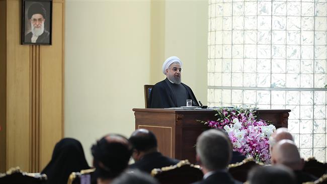 Iranian President Hassan Rouhani delivers a speech at a ceremony attended by ambassadors and foreign envoys in Tehran