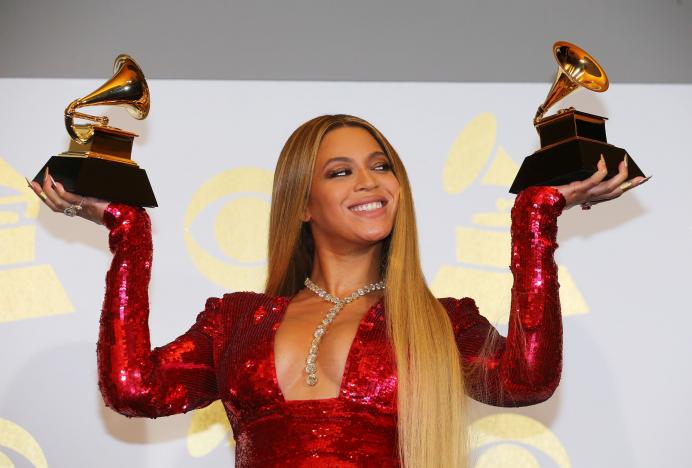 Beyonce holds the awards she won for Best Urban Contemporary Album for'Lemonade and Best Music Video for'Formation at the 59th Annual Grammy Awards in Los Angeles California U.S