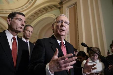 Senate Majority Leader Mitch Mc Connell of Ky. center joined from left by Sen. John Barrasso R-Wyo. and Sen. John Thune R-S.D. takes questions from reporters about President Donald Trump's ousted national security adviser Michael Flynn Tuesday