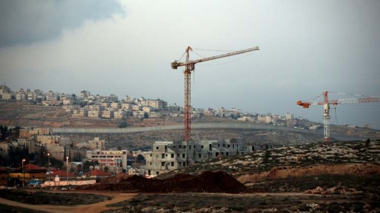 Israel's controversial wall separating the Jewish settlement of Neve Yaakov in the northern area of east Jerusalem and the Palestinian neighborhood of al Ram in the West Bank