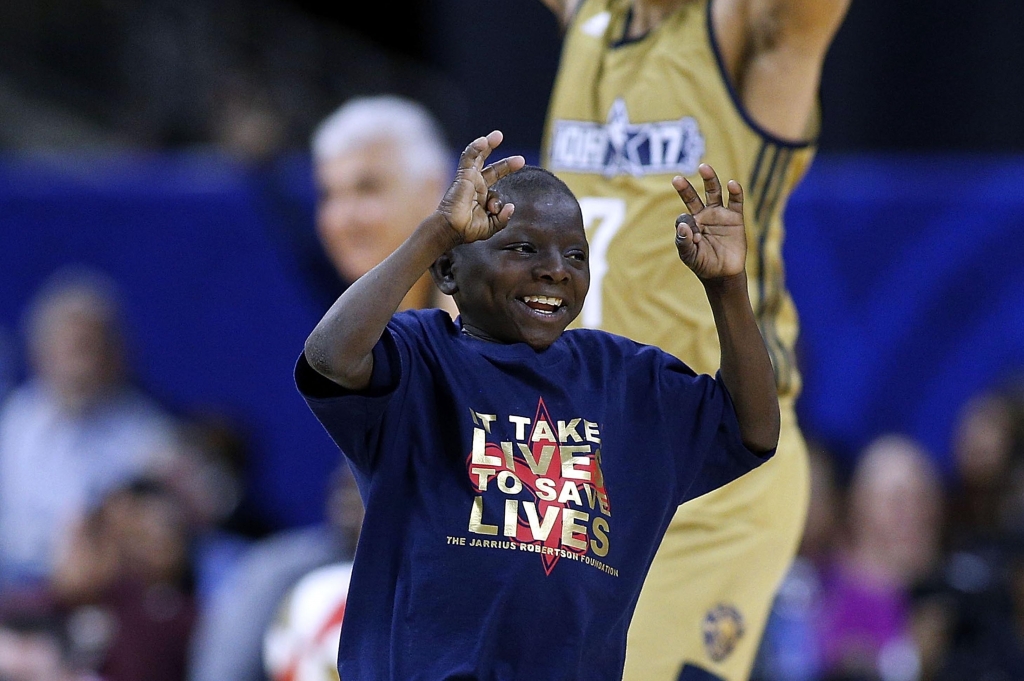 NEW ORLEANS LA- FEBRUARY 17 New Orleans Saints Super Fan Jarrius'Little JJ Robertson celebreates after scoring during the NBA All Star Celebrity Game at the Mercedes Benz Superdome