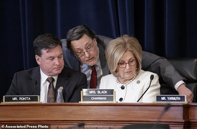 House Budget Committee Chair Diane Black R-Tenn. right joined at left by Rep. Todd Rokita R-Ind. and panel staff member Jim Bates center works on the Republican health care bill on Capitol Hill in Washington Thursday March 16 2017. (AP