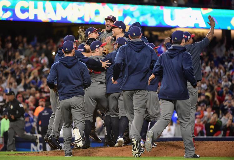 Eric Hosmer and his United States teammates celebrate their 8-0 win against previously undefeated Puerto Rico