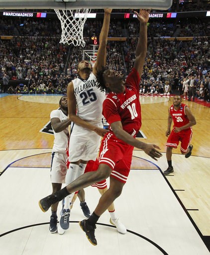 Wisconsin forward Nigel Hayes scores the game-winning basket against Villanova guard Mikal Bridges with 11 seconds to play in the second half of a second-round men's college basketball game in the NCAA Tournament Sat