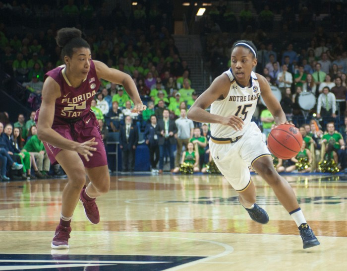 Irish senior guard Lindsay Allen dribbles past a defender during Notre Dame’s 79-61 win over Florida State on Feb. 26 at Purcell Pavilion