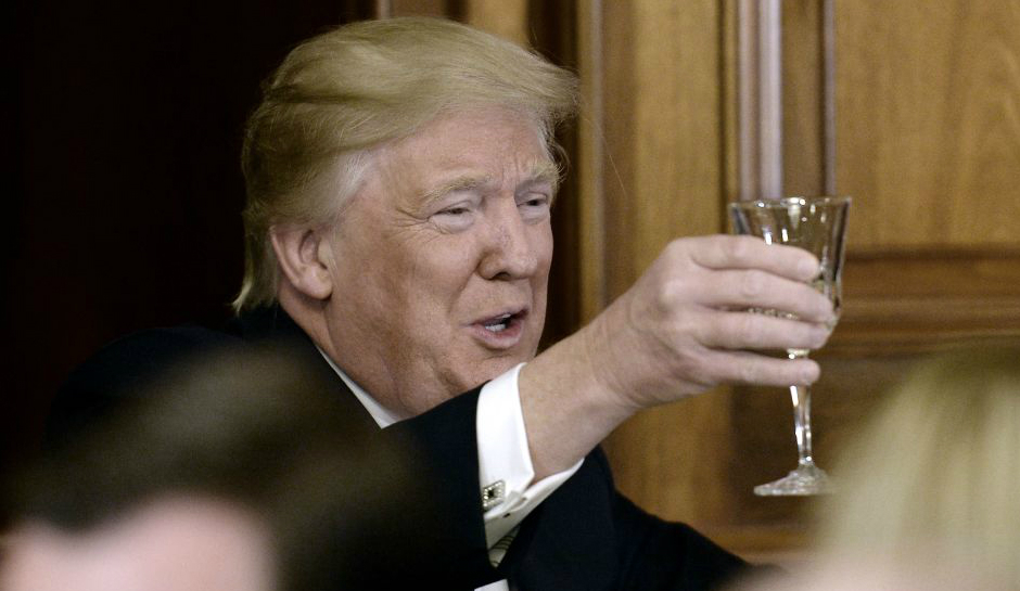 President Trump raises his glass at a Friends of Ireland luncheon