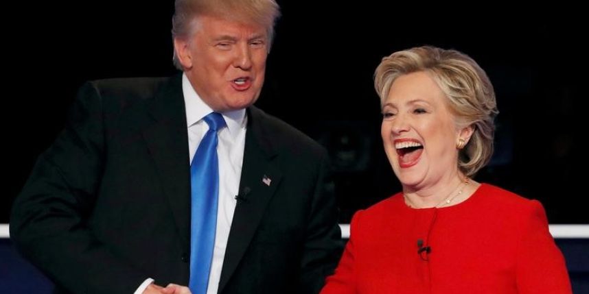 Presidential candidates Donald Trump and Hillary Clinton shake hands after their first debate in October 2016