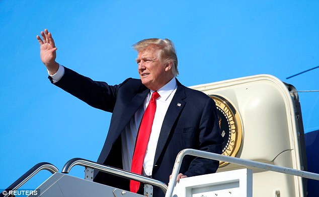 President Donald Trump waves as he steps from Air Force One upon his arrival in West Palm Beach Florida is signing an executive order requiring a review of a 2015 rule on waters of the United States