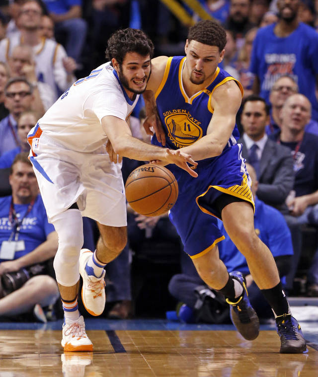 Oklahoma City's Alex Abrines steals the ball from Warriors&#039 Klay Thompson in Monday night's game at the Chesapeake Energy Arena. The Warriors won 111-95