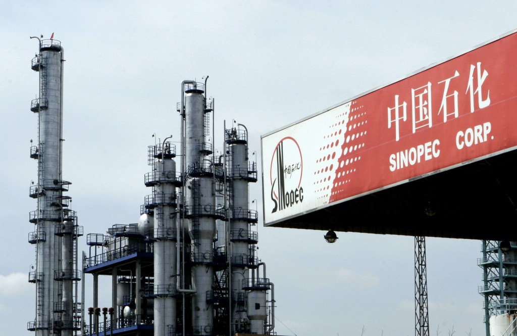 A Sinopec gas station besides oil refinery facilities of Sinopec in Pudong of Shanghai China