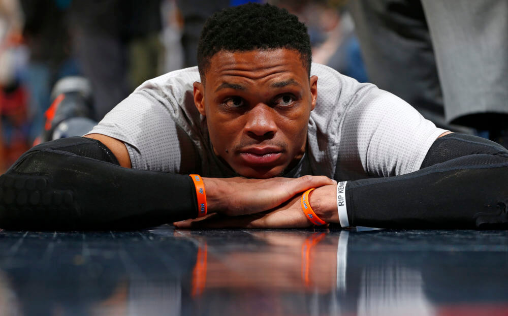 Oklahoma City Thunder guard Russell Westbrook stretches before a game against the Denver Nuggets Sunday