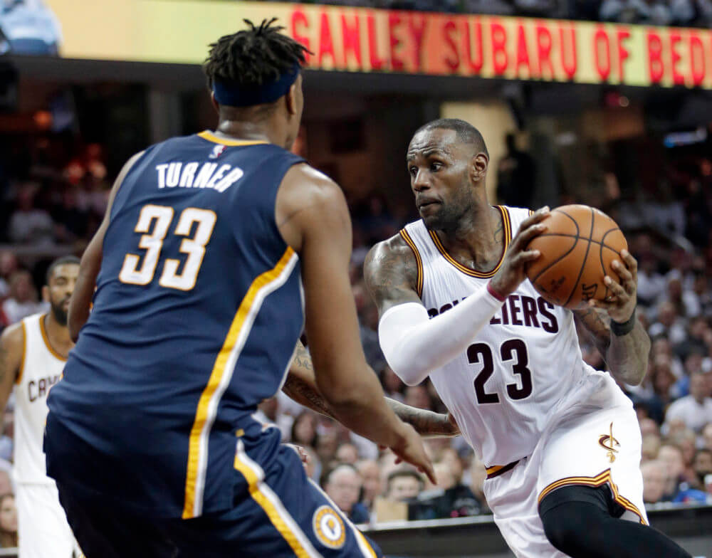 Cleveland Cavaliers&#039 Le Bron James drives past Indiana Pacers&#039 Myles Turner in the first half in Game 1 of a first-round NBA basketball playoff series Saturday