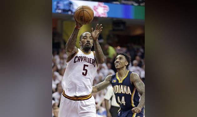 Cleveland Cavaliers&#039 J.R. Smith passes against Indiana Pacers&#039 Jeff Teague in the first half in Game 2 of a first-round NBA basketball playoff series Monday