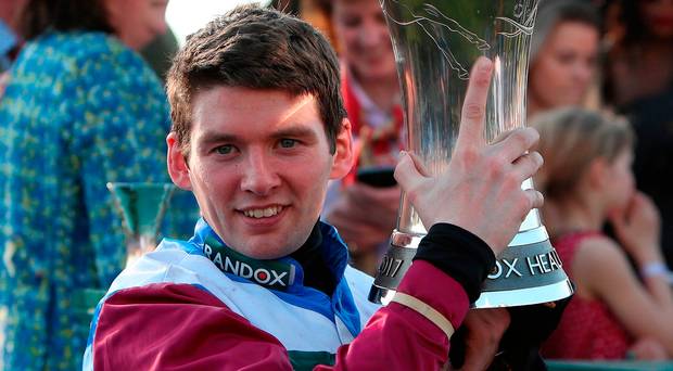 Derek Fox celebrates with the trophy after winning the Randox Health Grand National on One For Arthur