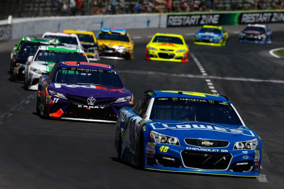 FORT WORTH TX- APRIL 09 Jimmie Johnson driver of the #48 Lowe's Chevrolet leads a pack of cars during the Monster Energy NASCAR Cup Series O'Reilly Auto Parts 500 at Texas Motor Speedway