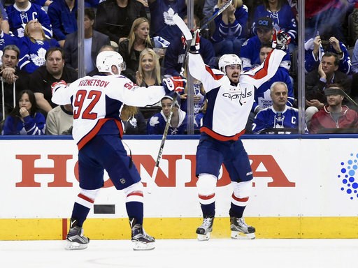 Washington Capitals centre Marcus Johansson celebrates with center Evgeny Kuznetsov after scoring against the Toronto Maple Leafs during Game 6 of an NHL hockey Stanley Cup first-round playoff serie