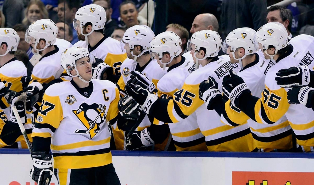 Pittsburgh Penguins centre Sidney Crosby gets congratulations on his goal against the Toronto Maple Leafs during the second period of an NHL hockey game in Toronto on Saturday