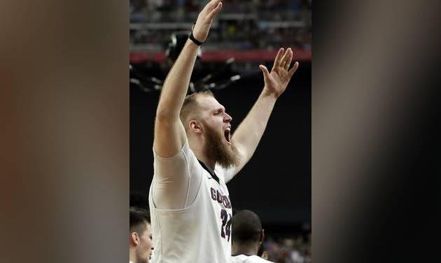 Gonzaga's Przemek Karnowski celebrates after the semifinals of the Final Four NCAA college basketball tournament against South Carolina Saturday