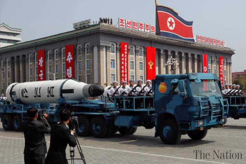 North Korea displays apparently new missiles as US carrier group approaches