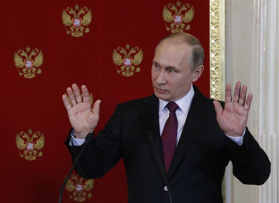 Russian President Vladimir Putin reacts during a joint press conference with Italian counterpart Sergio Mattarella after a meeting in Moscowís Kremlin Russia Tuesday