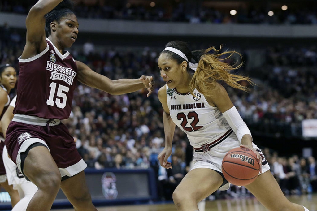 South Carolina forward A'ja Wilson drives around Mississippi State center Teaira Mc Cowan during the first half in the championship game of the NCAA women's Final Four college basketball