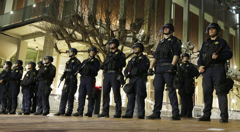 University of California Berkeley police guard the building where Breitbart News editor Milo Yiannopoulos was to speak. The campus is bracing for a showdown next week when the conservative provocateur Ann Coulter