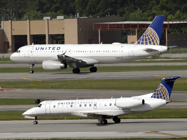 Two United Airlines planes taking off at George Bush Intercontinental Airport in Houston. After a man was dragged off a United flight the company changed its policy on overbooked flights