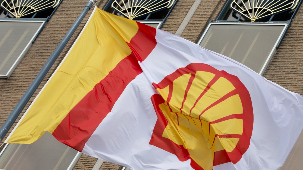 A flag bearing the company logo of Royal Dutch Shell flies outside the energy giant's head office in The Hague Netherlands in 2014