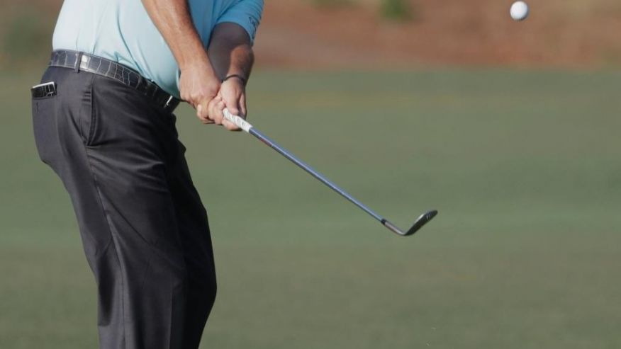 Phil Mickelson hits on the 10th green during the first round of The Players Championship golf tournament Thursday