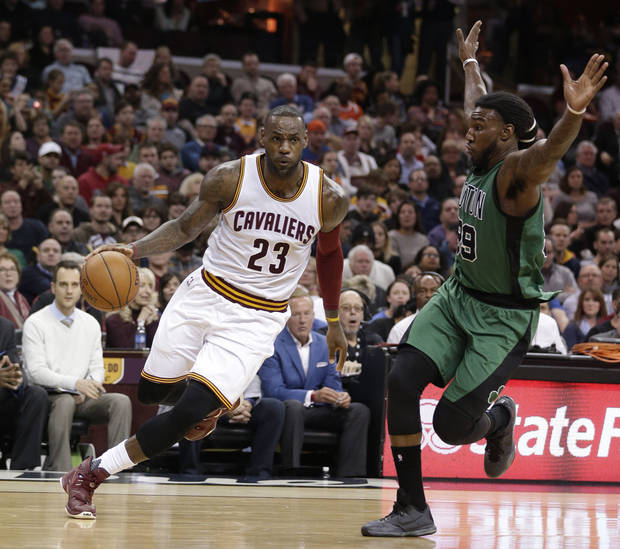 LeBron James drives past Boston's Jae Crowder in a game from last season