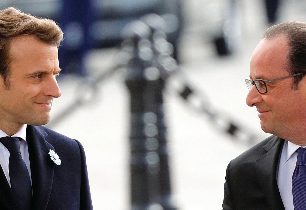 French President-elect Emmanuel Macron left and outgoing President Francois Hollande attend a ceremony to mark the end of World War II at the Arc de Triomphe in Paris on Monday. Macron defeated far-right leader Marine Le Pen handily in Sunday's presid