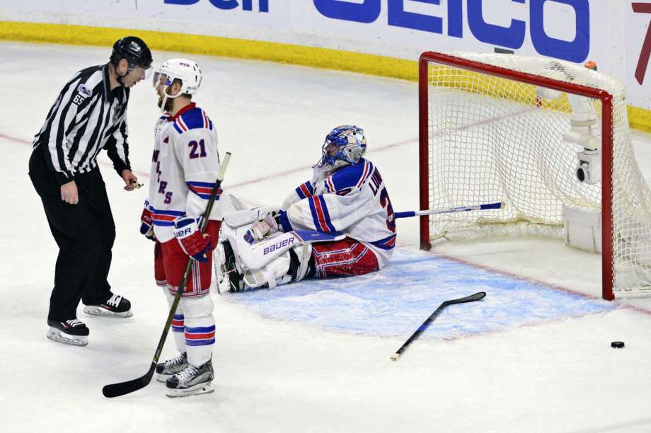 New York Rangers goalie Henrik Lundqvist and center Derek Stepan react after the Ottawa Senators scored to tie the game late in the third period in Game 5 in the second-round of the NHL hockey Stanley Cup playoffs in Ottawa on Saturday