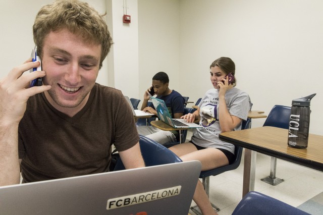 Cameron Keller a first-year political science student Matt Dunham a second-year political science student and Erica Griggs a first-year English student call Montanans and urge them to vote Rob Quist for Congress