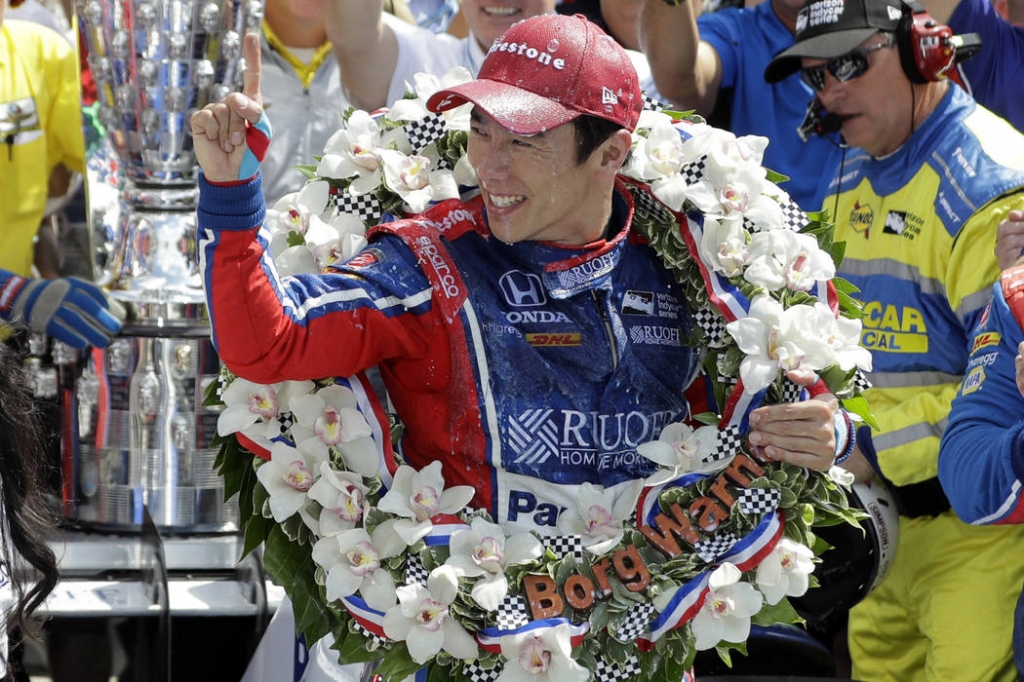 Takuma Sato of Japan celebrates winning the Indianapolis 500 auto race at Indianapolis Motor Speedway Sunday