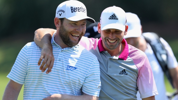 Masters champion Sergio Garcia right shares a laugh with Branden Grace during Wednesday's practice round at the Tournament Players Championship in Florida