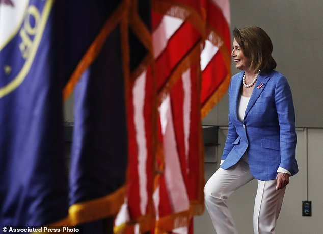 House Minority Leader Nancy Pelosi of Calif. arrives for a news conference on Capitol Hill in Washington Thursday