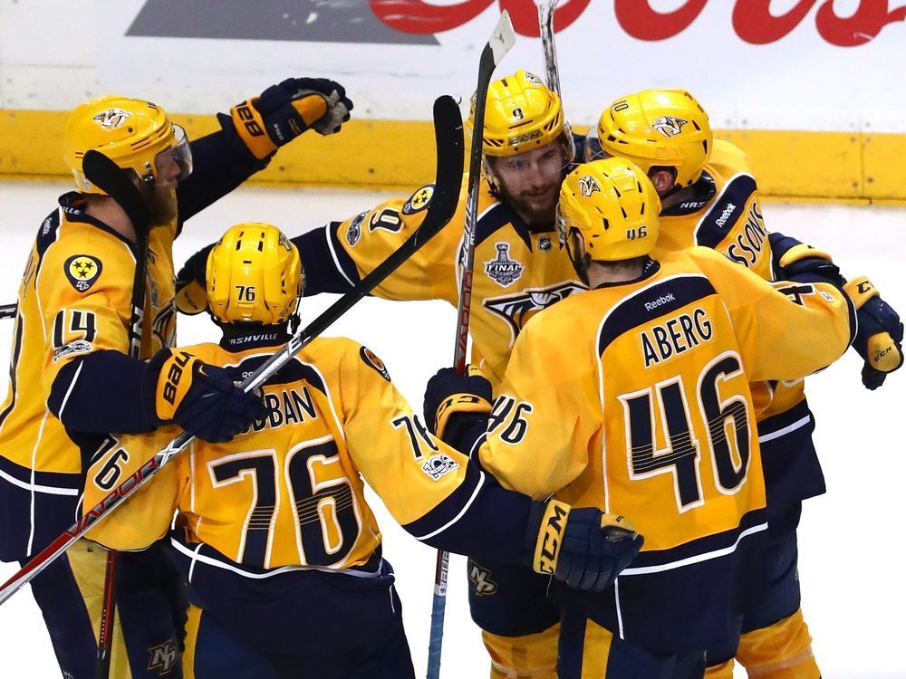 Filip Forsberg of the Nashville Predators celebrates with his teammates after scoring an open-net goal against the Pittsburgh Penguins during the third period in Game Four of the 2017 NHL Stanley Cup Final at the Bridgestone Arena