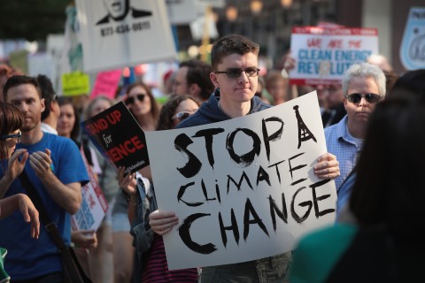 Demonstrators protest President Trump’s decision to exit the Paris climate change accord